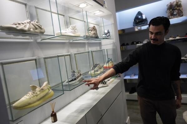 Adidas breakup with Ye drives lower earnings outlook AP News